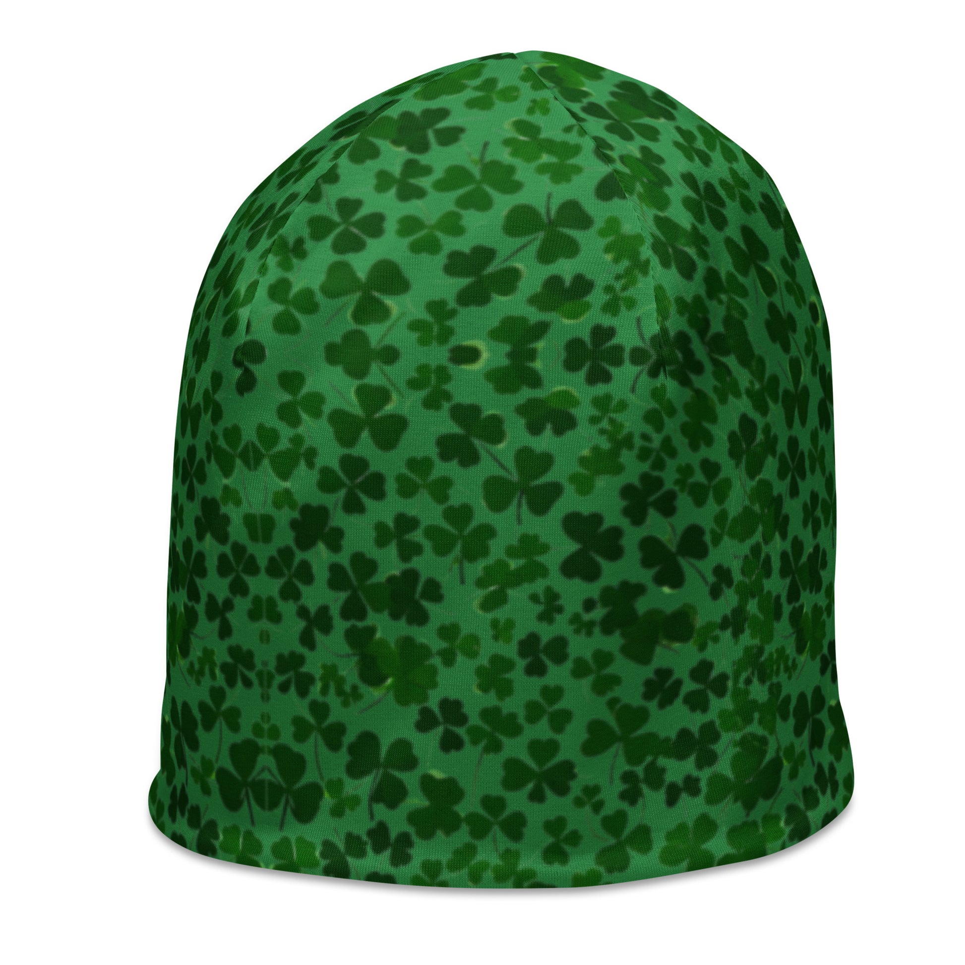 The Shamrock Beanie from Blue Sky Runners is a fashionable, double-layered green hat adorned with a pattern of dark green shamrocks of different sizes scattered across its surface.