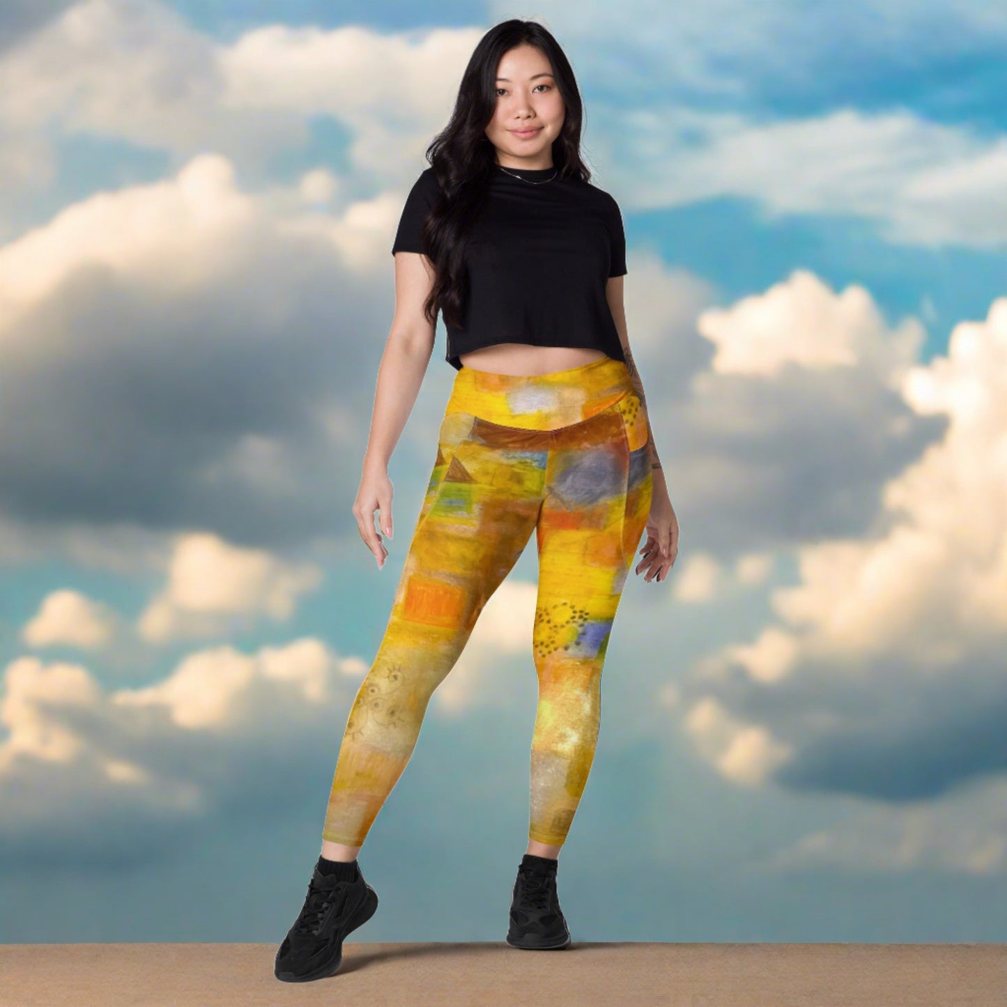 Woman in colorful abstract beach themed tights and a black top