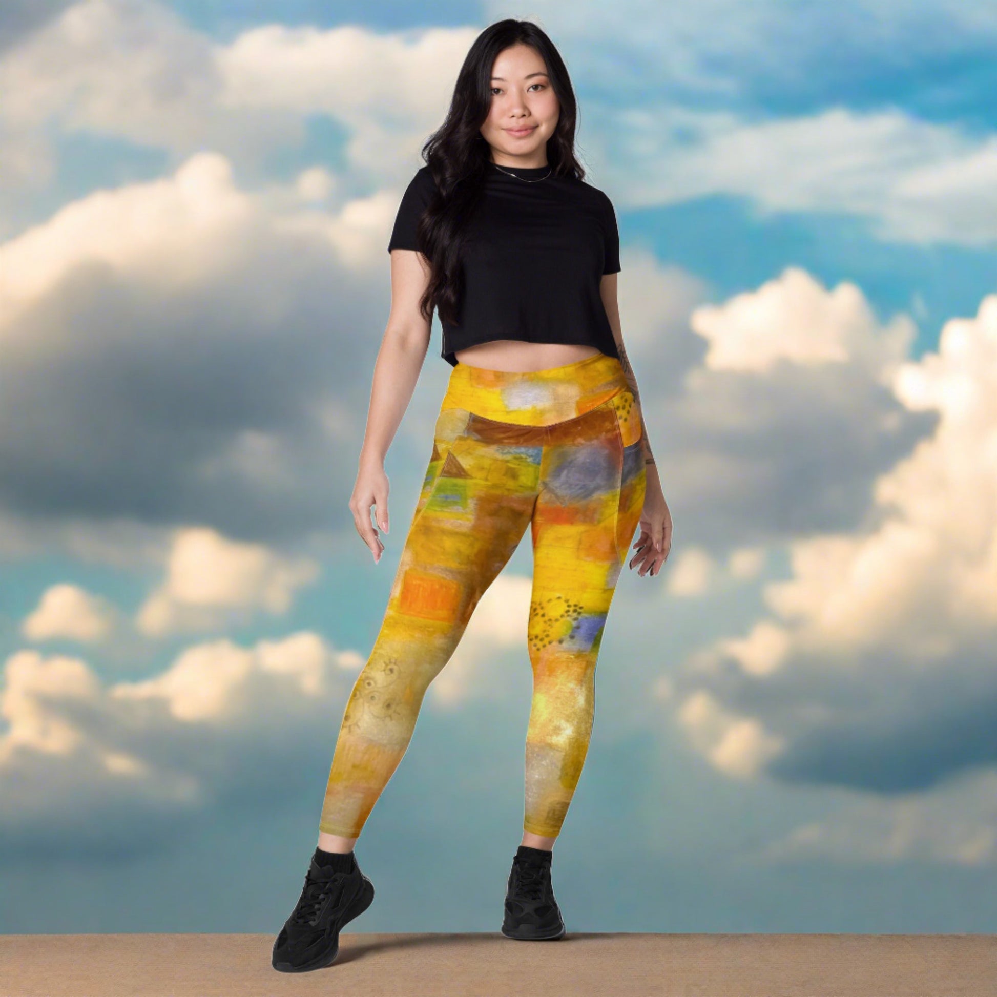 Woman in colorful abstract beach themed tights and a black top